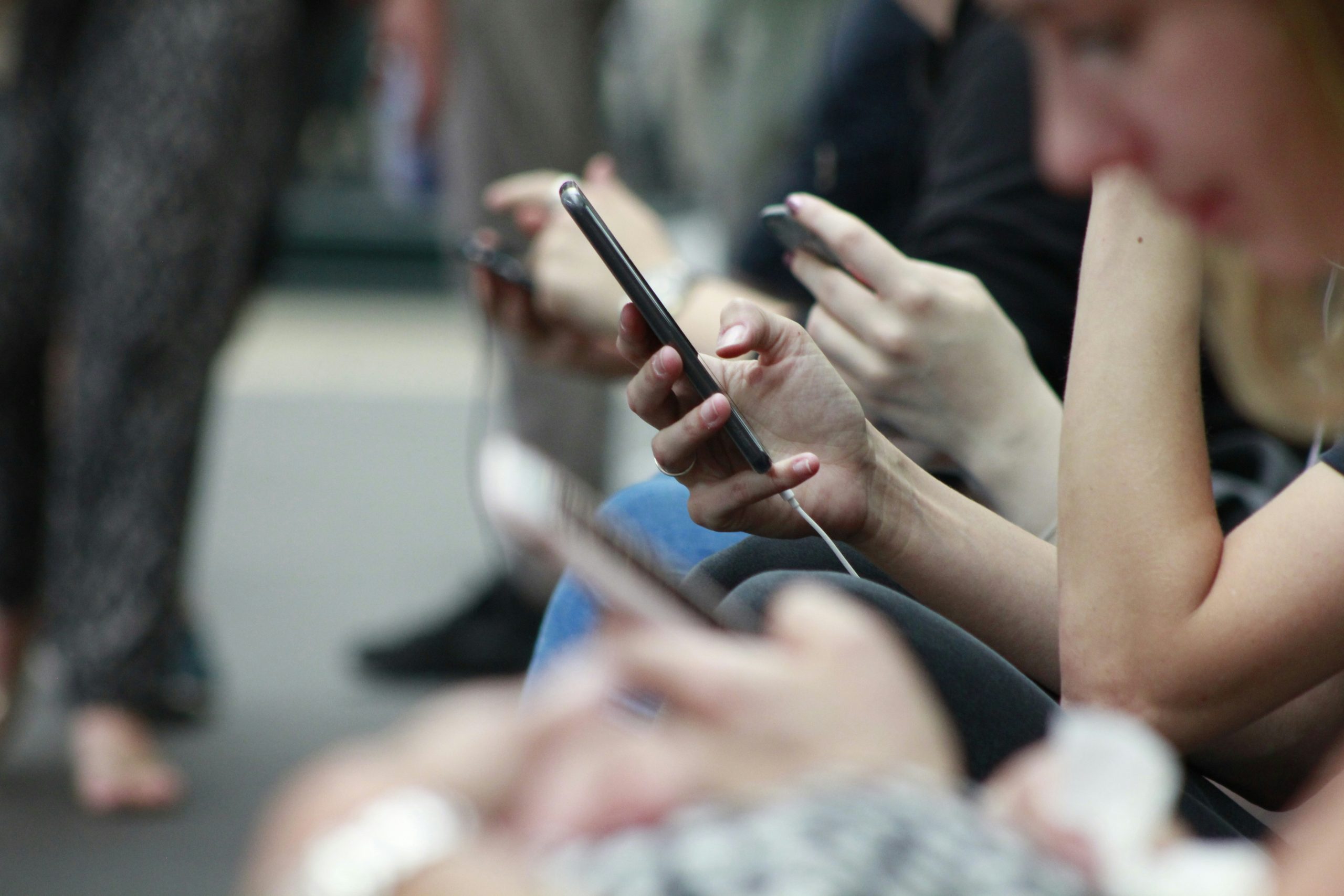 people scrolling through their phones