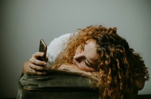 stressed woman scrolling through her phone